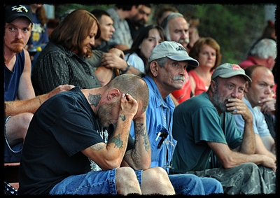 James Smith, left, waits at the Wise County Fairgrounds to access a health clinic that offers free medical, dental, and vision care on a first-come, first-served basis, so lines start early and get long quickly. By Michael Williamson (Washington Post)