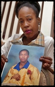 medium_sakiagunn LaTona Gunn holds a 2001 photo of her daughter, Sakia Gunn, at her home in Newark. Sakia, 15, was stabbed to death while waiting for the bus in Newark after she and her friends told her attacker they were lesbians.