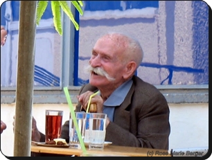 Old Greek shepherd in the cafe.