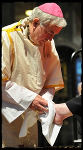 Archbishop Nichols of U.K. washes feet on Holy Thursday.