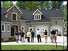 Outside model home decorated from thrift stores