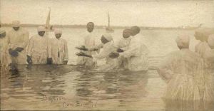 1024px-River_baptism_in_New_Bern
