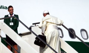 Pope Francis boards commercial flight for Brazil for World Youth Day.