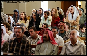christians-muslims-iraq-yon Christians and Muslims attend Mass in Baghdad as a celebration for Muslims rebuilding the church.